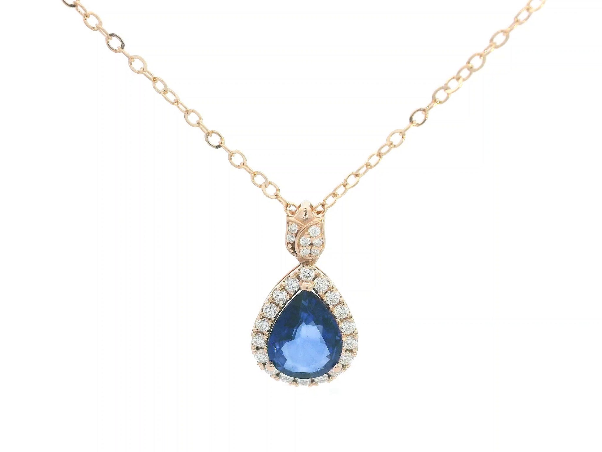 Teardrop-shaped blue gemstone necklace with gold chain on a white background