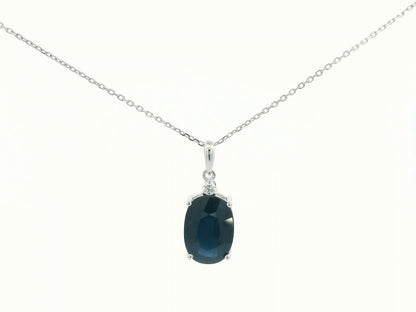 Oval-cut blue sapphire pendant with round diamond in white gold