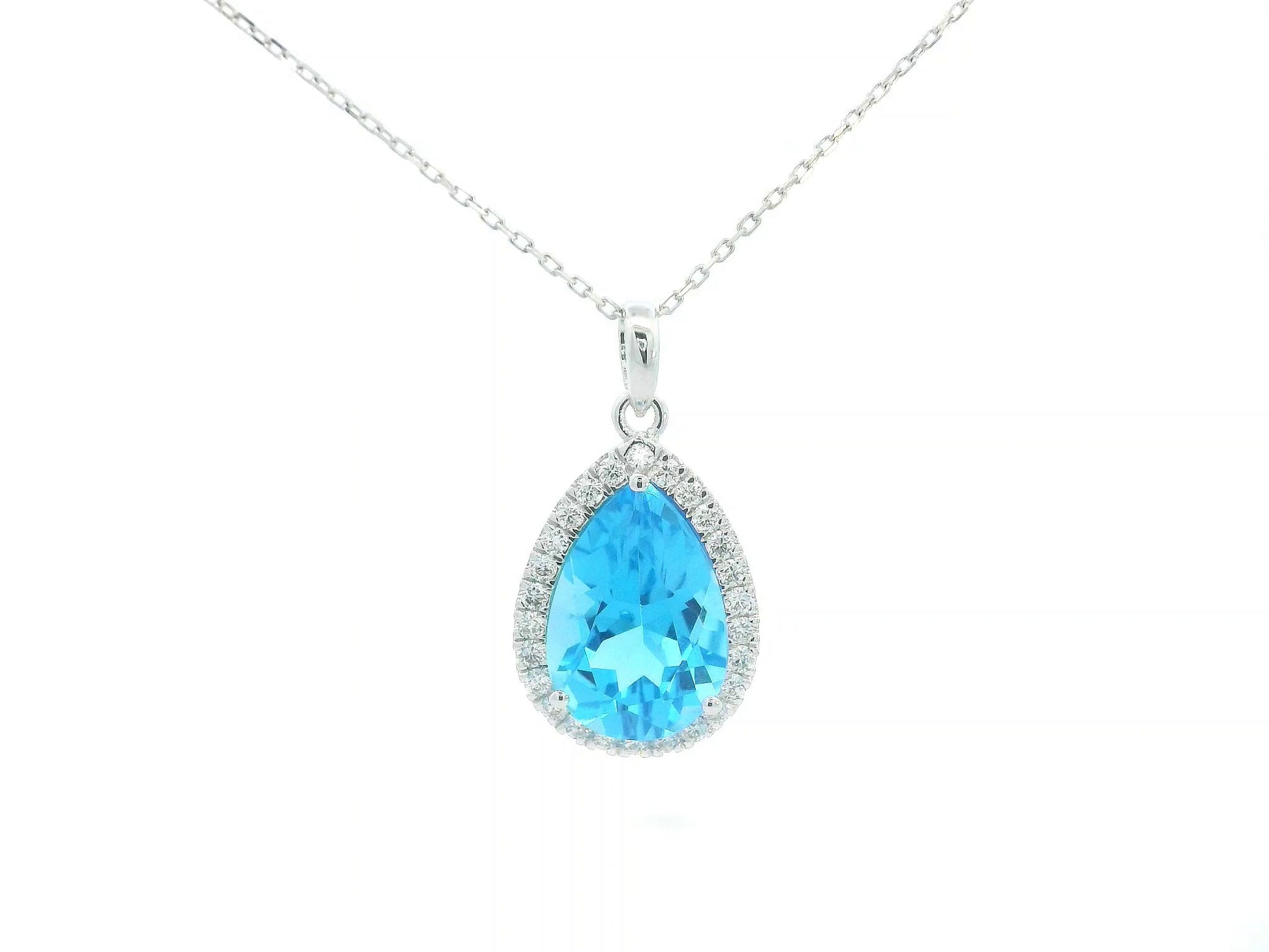 Pear-shaped Swiss Blue Topaz pendant in 18K white gold with diamond halo