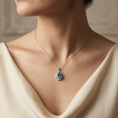 Swiss Blue Topaz & Diamond Halo Pendant in 18K White Gold – 7.05 Carat