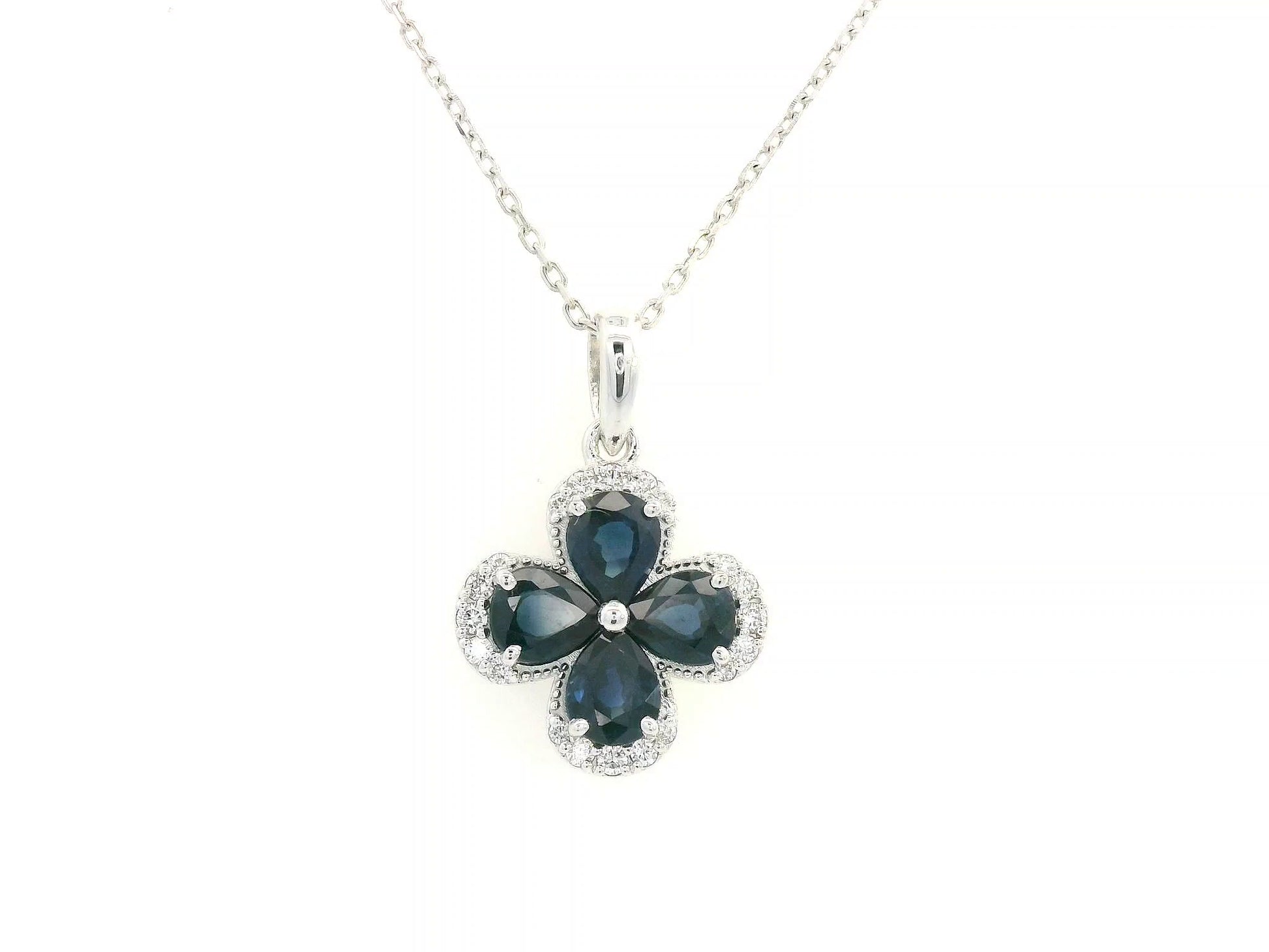 Floral sapphire pendant in 18K white gold with diamond accents