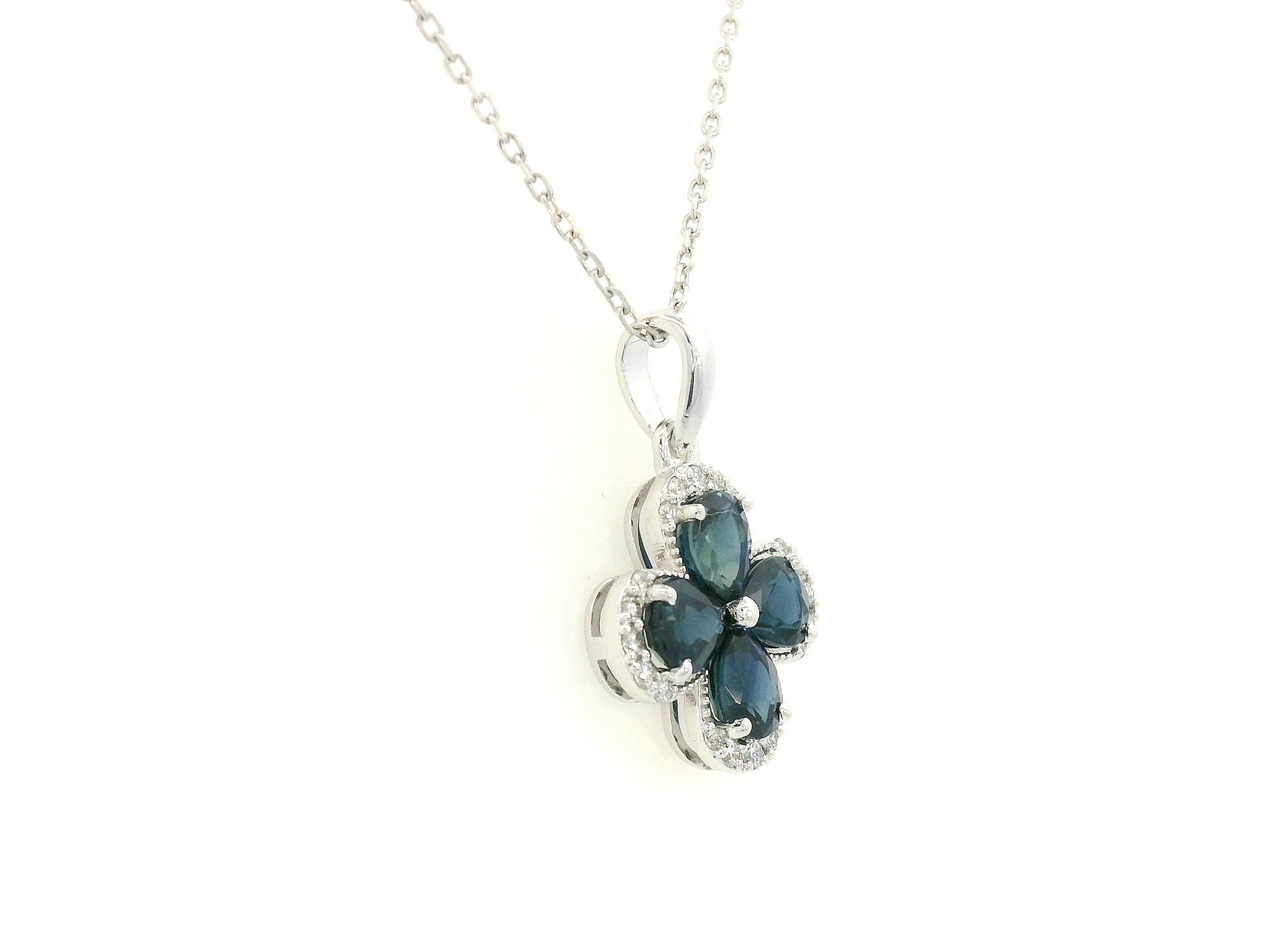 Blue sapphire and diamond flower pendant for women