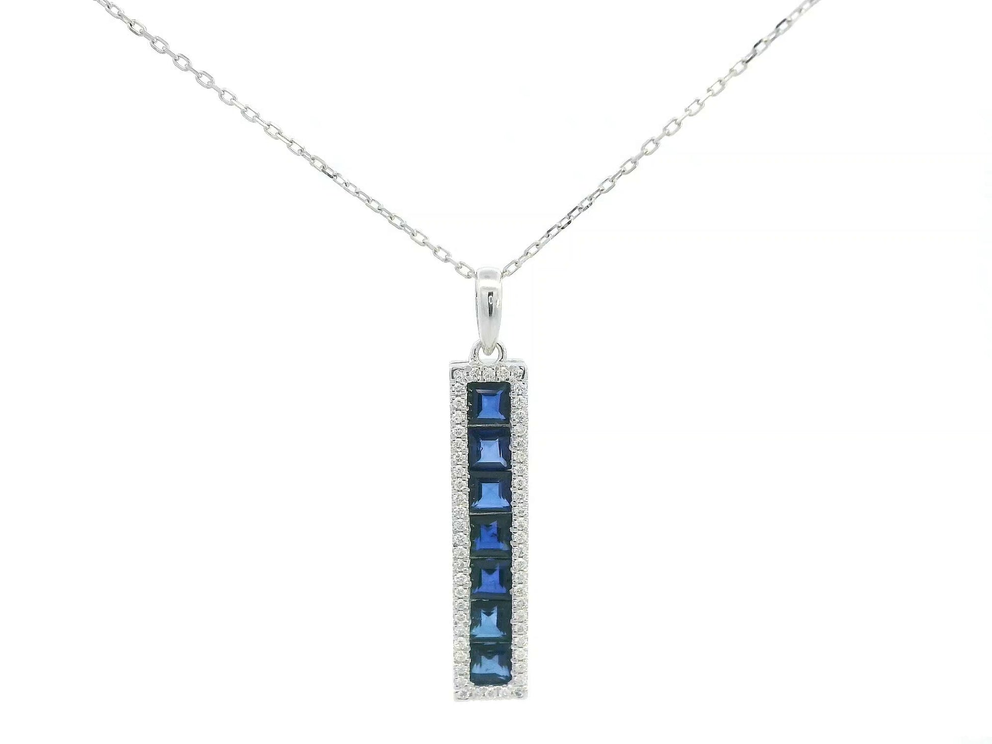 18K white gold pendant with blue sapphires and diamond accents