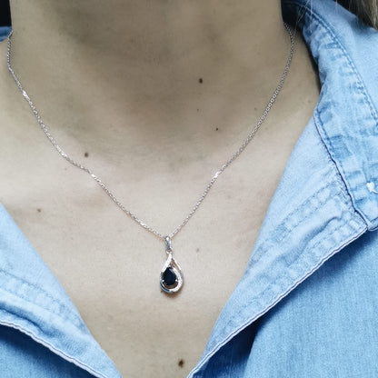 18k white gold pendant with 0.92-carat pear-cut blue sapphire and 0.07-carat diamond accents