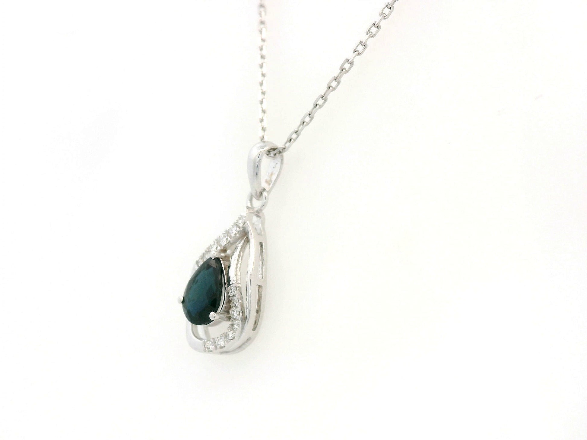 18k white gold pendant with 0.92-carat pear-cut blue sapphire and 0.07-carat diamond accents