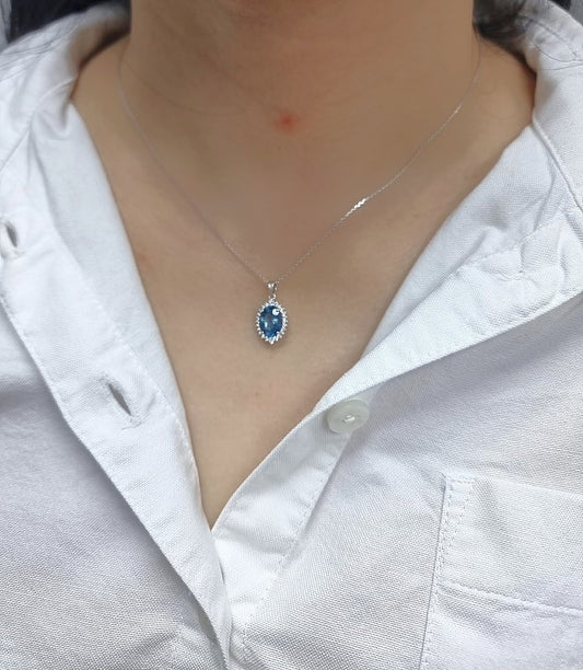 18k white gold oval London Blue Topaz halo pendant with diamonds – chain not included”