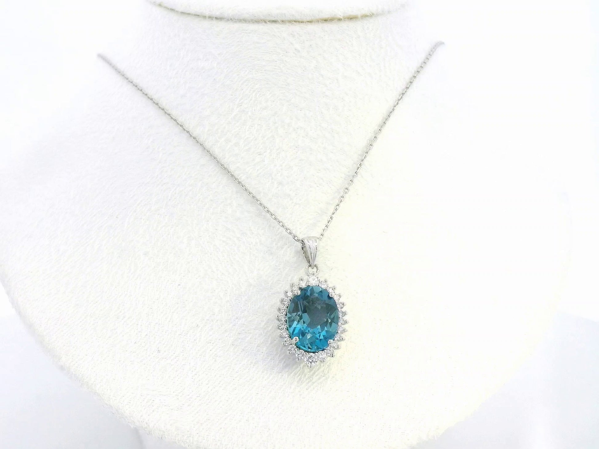 18k white gold oval London Blue Topaz halo pendant with diamonds – chain not included”