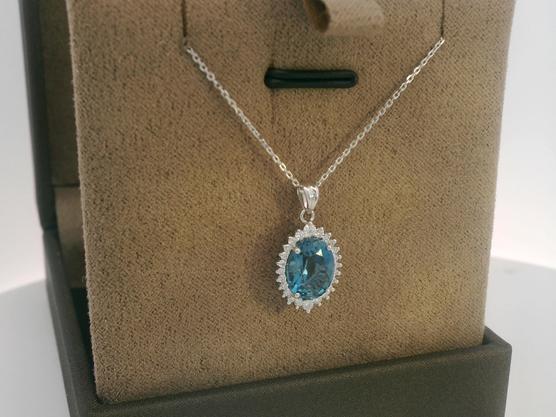 18k white gold oval London Blue Topaz halo pendant with diamonds – chain not included”