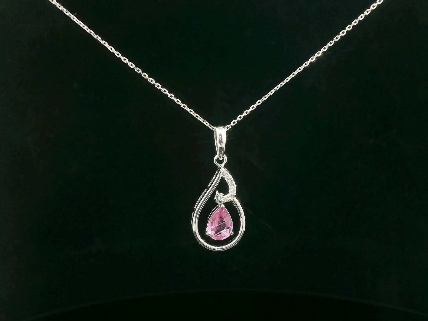 18k white gold pendant with 0.68 CT pear-shaped pink sapphire and 0.05 CT diamond accents
