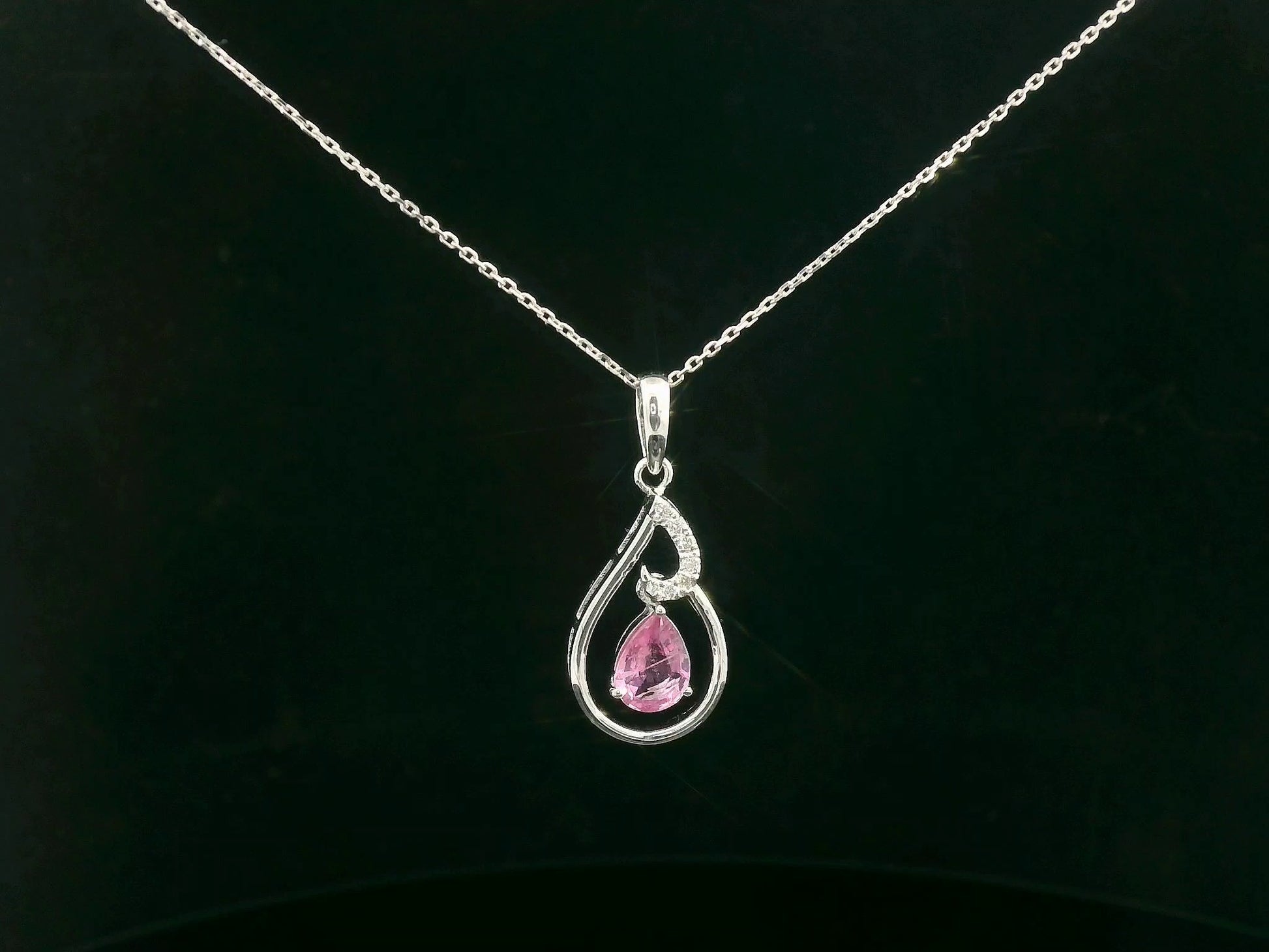 18k white gold pendant with 0.68 CT pear-shaped pink sapphire and 0.05 CT diamond accents