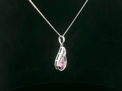 Side profile of pear-shaped pink sapphire pendant with diamond swirl design