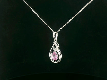 Side profile of pear-shaped pink sapphire pendant with diamond swirl design