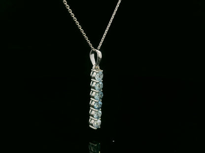 18k gold vertical bar pendant with six round-cut aquamarines totaling 0.72 carat
