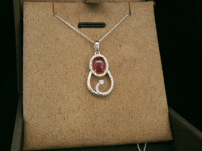 18k white gold swirl pendant with 1.99ct cabochon ruby & 0.21ct diamonds – certificate included