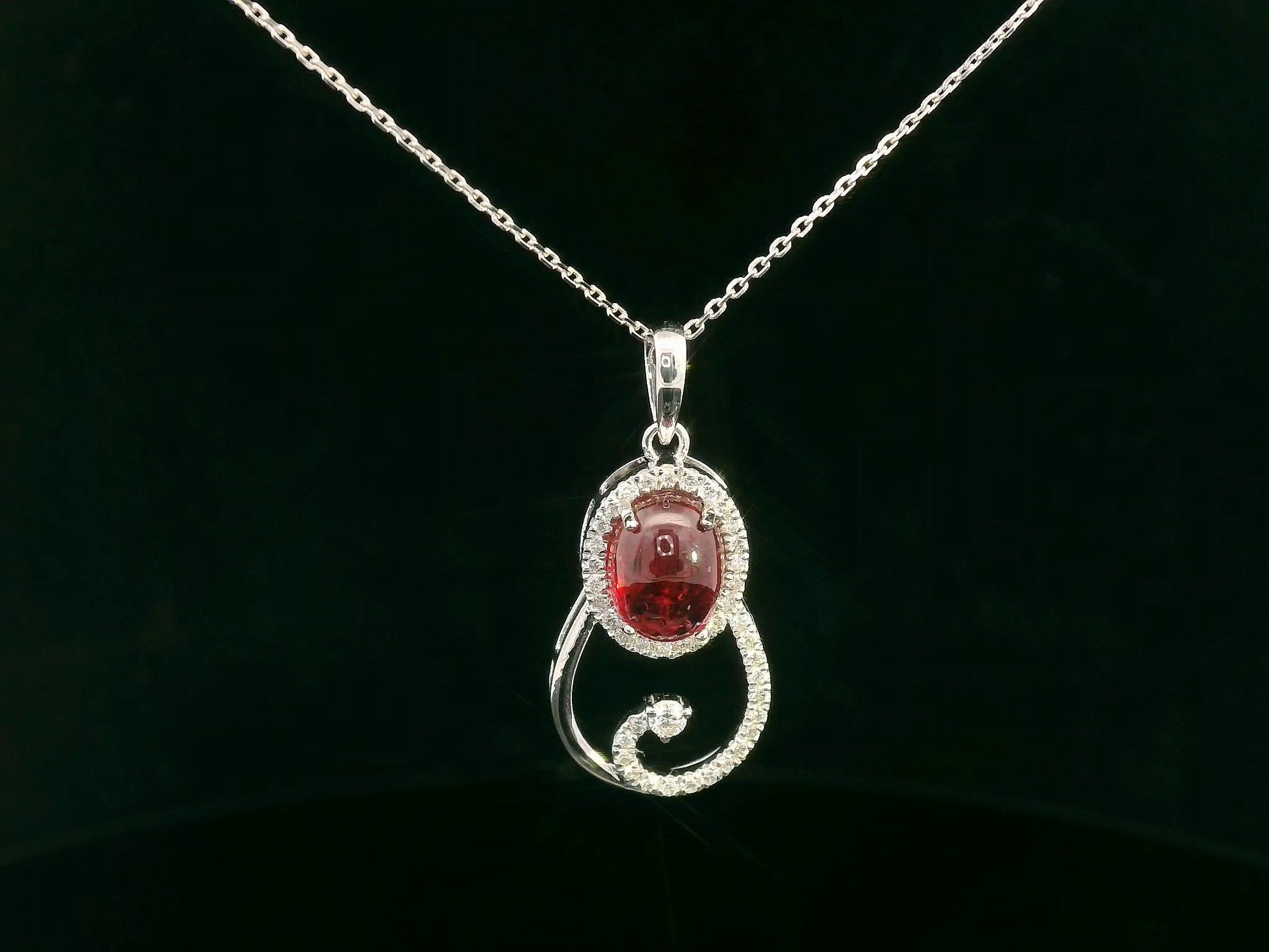 18k white gold swirl pendant with 1.99ct cabochon ruby & 0.21ct diamonds – certificate included