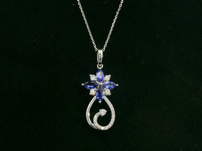 18K white gold Tanzanite and diamond floral paisley pendant featuring marquise-cut Tanzanites and pavé-set diamonds