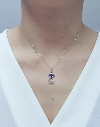 18K white gold Tanzanite and diamond floral paisley pendant featuring marquise-cut Tanzanites and pavé-set diamonds