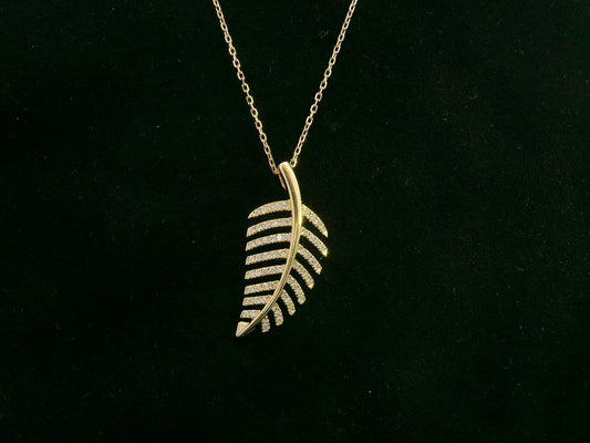 18K yellow gold leaf-shaped pendant with pavé-set diamonds, elegant nature-inspired jewelry