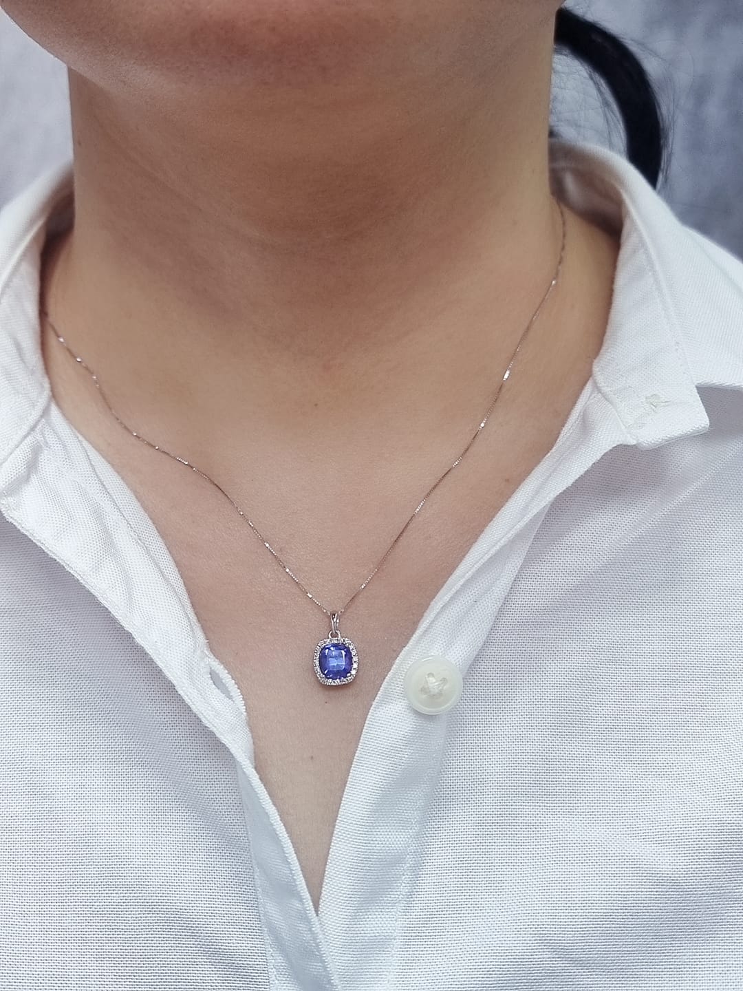 18K white gold Tanzanite and diamond halo pendant with cushion-cut 2.02 carat center stone