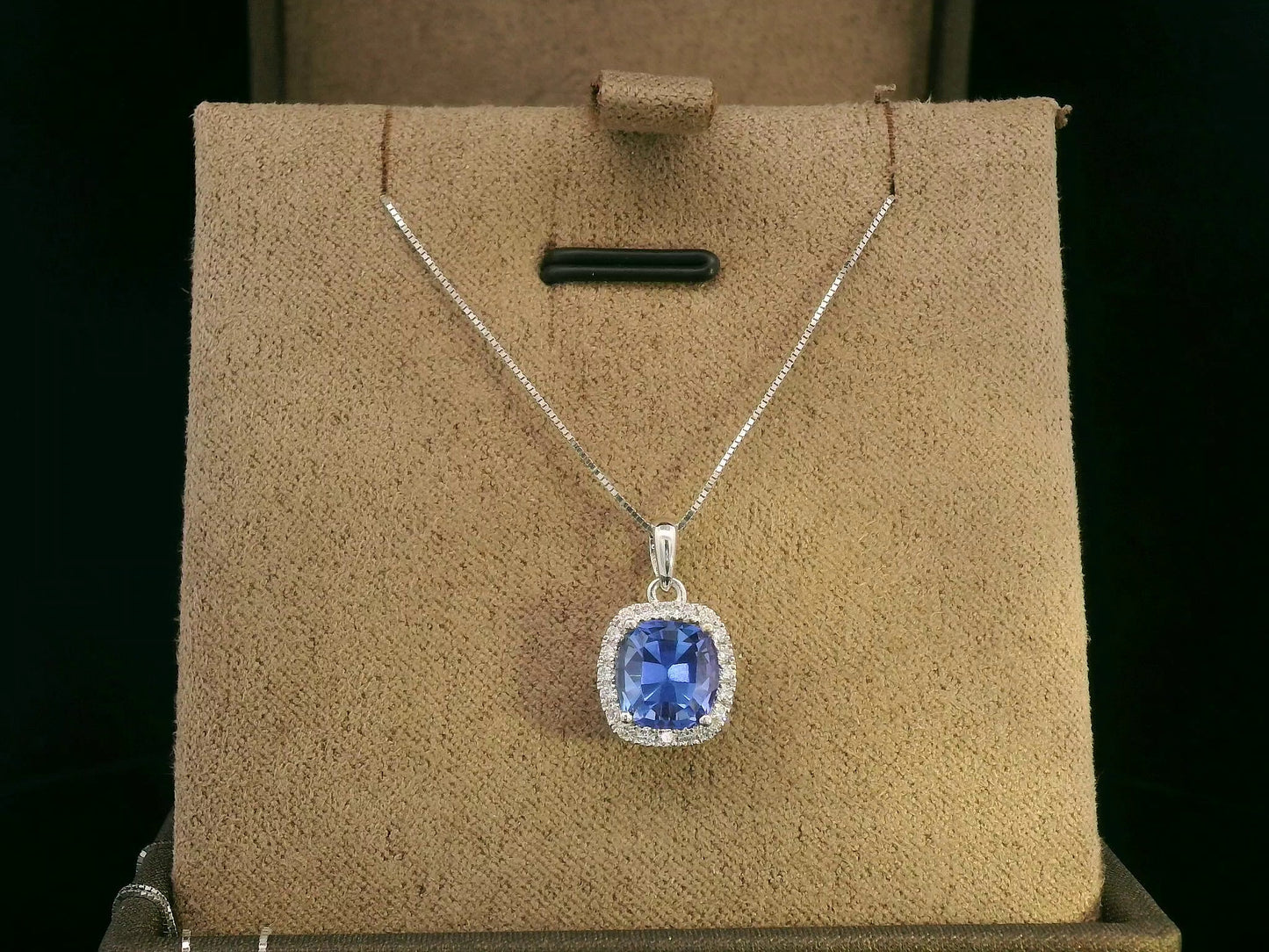 18K white gold Tanzanite and diamond halo pendant with cushion-cut 2.02 carat center stone