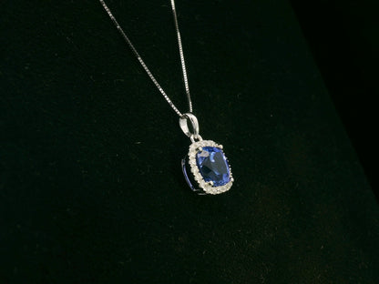 18K white gold Tanzanite and diamond halo pendant with cushion-cut 2.02 carat center stone