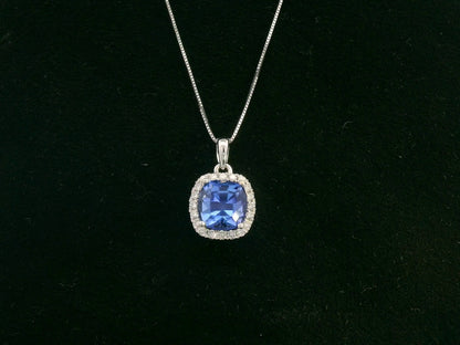 18K white gold Tanzanite and diamond halo pendant with cushion-cut 2.02 carat center stone