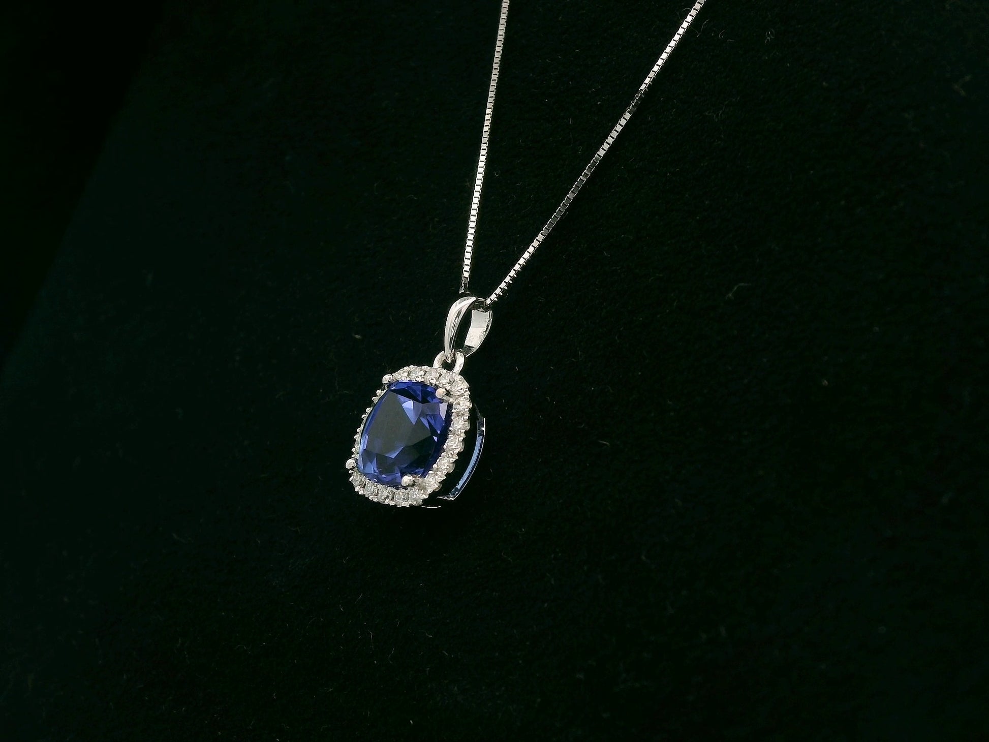 18K white gold Tanzanite and diamond halo pendant with cushion-cut 2.02 carat center stone