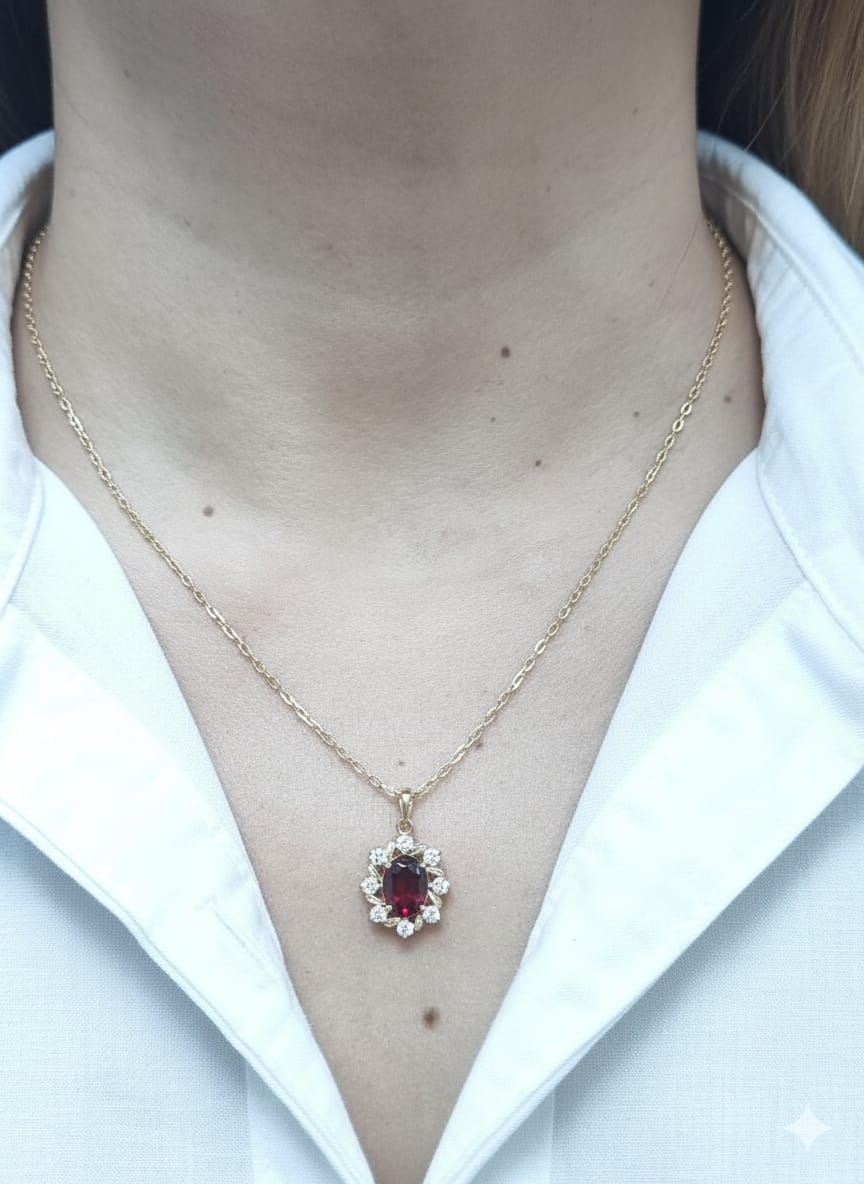 Oval-cut garnet and diamond necklace in 18K yellow gold by Emirates Diamonds