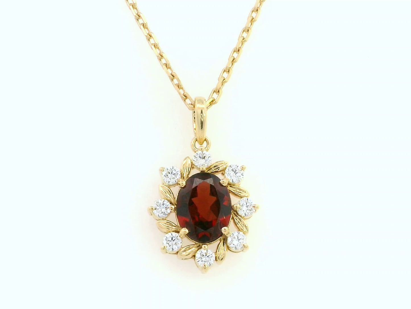 Oval-cut garnet and diamond necklace in 18K yellow gold by Emirates Diamonds
