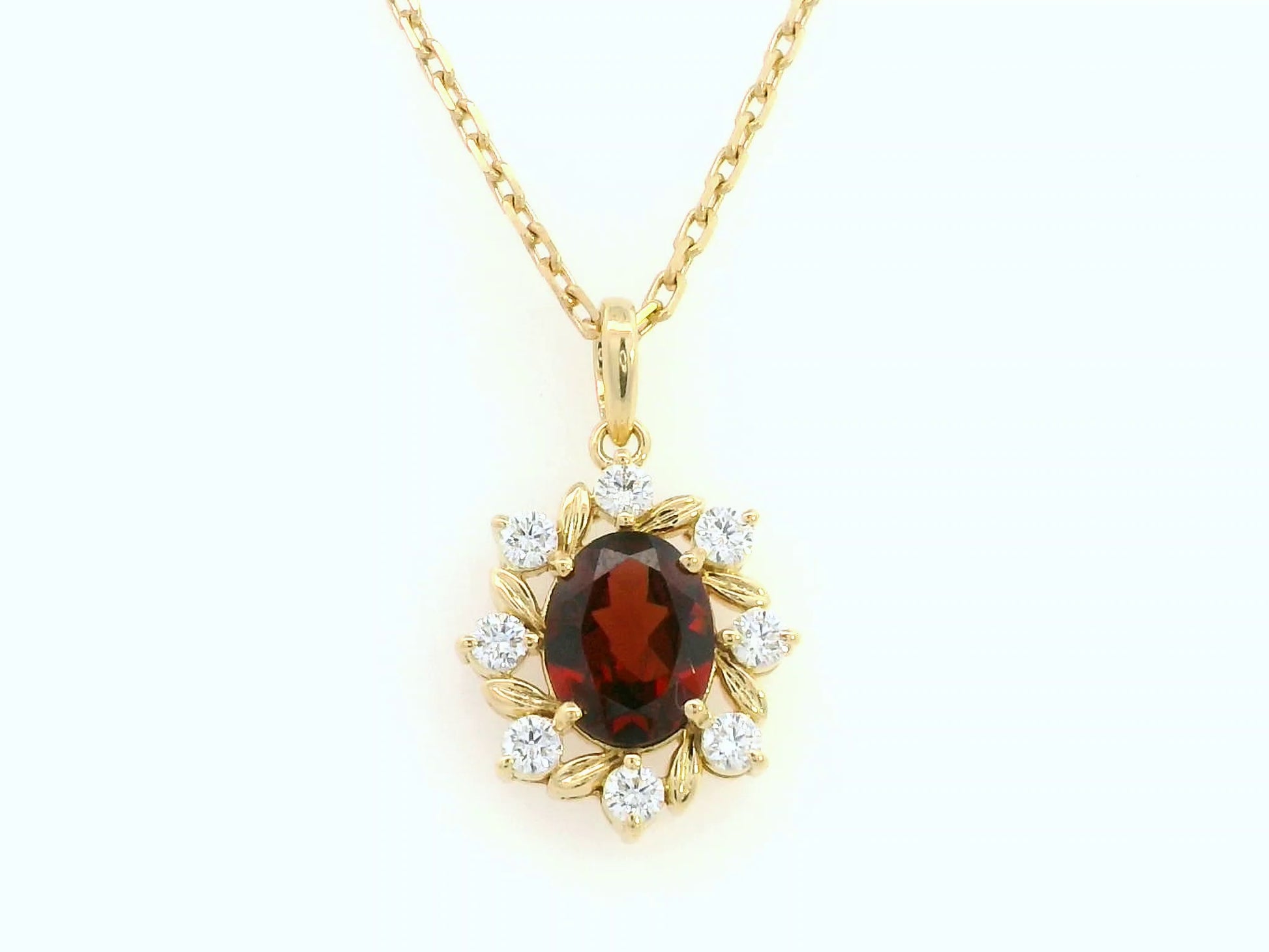 Oval-cut garnet and diamond necklace in 18K yellow gold by Emirates Diamonds