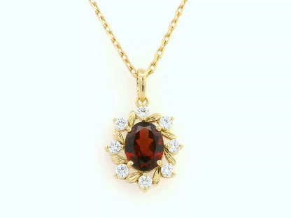 Oval-cut garnet and diamond necklace in 18K yellow gold by Emirates Diamonds