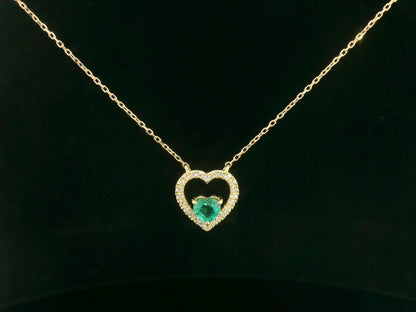 Heart-shaped emerald and diamond necklace in 18K yellow gold
