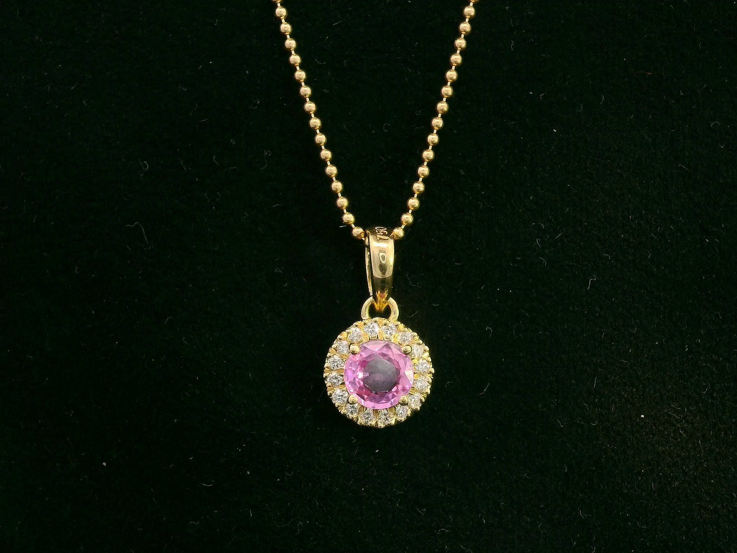 18K yellow gold pink sapphire and diamond halo pendant  – fine jewelry by Emirates Diamonds