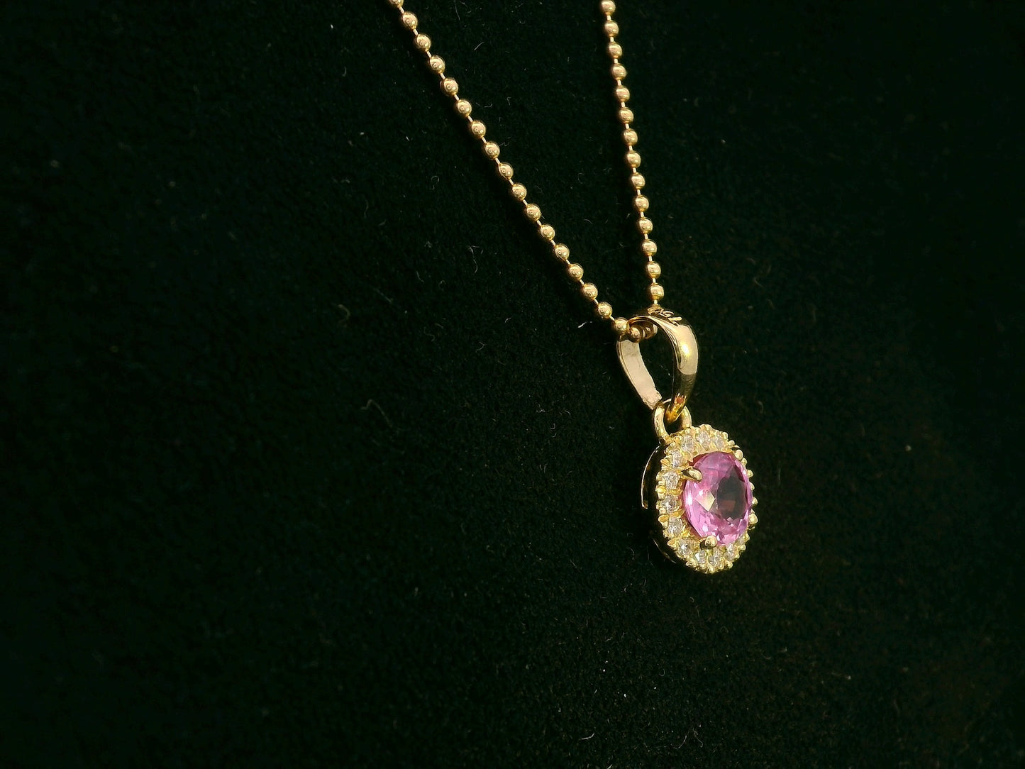 18K yellow gold pink sapphire and diamond halo pendant  – fine jewelry by Emirates Diamonds