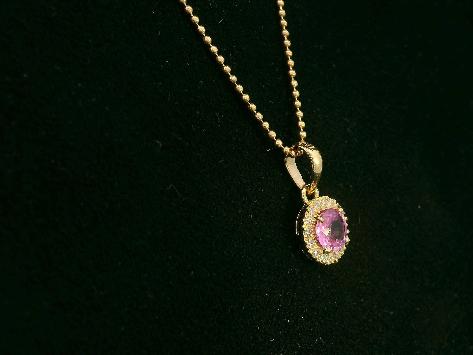 18K yellow gold pink sapphire and diamond halo pendant  – fine jewelry by Emirates Diamonds