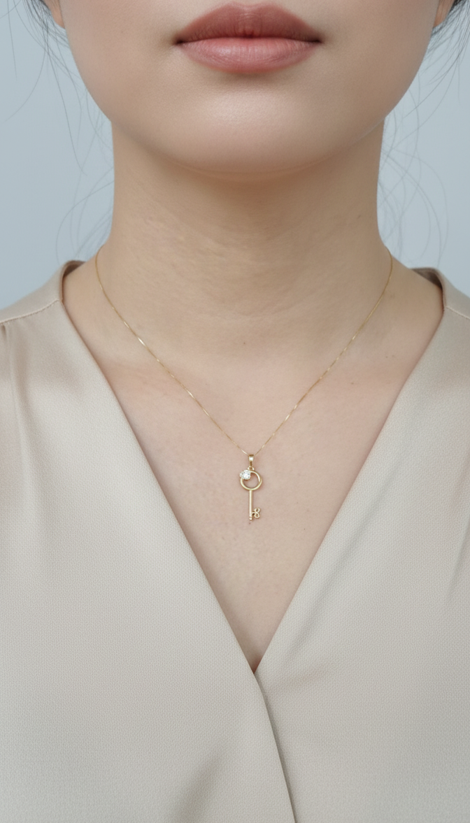 18K yellow gold diamond key pendant with heart accent – fine jewelry by Emirates Diamonds