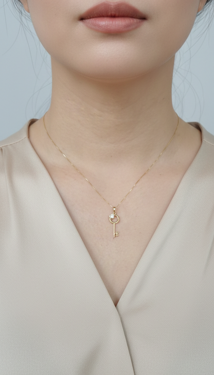 18K yellow gold diamond key pendant with heart accent – fine jewelry by Emirates Diamonds