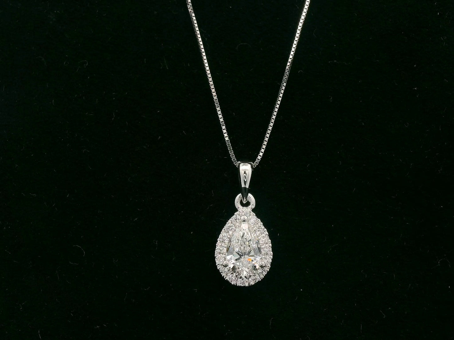 18K white gold pear diamond pendant with 0.51ct D SI1 GIA diamond and 0.14ct halo – Emirates Diamonds