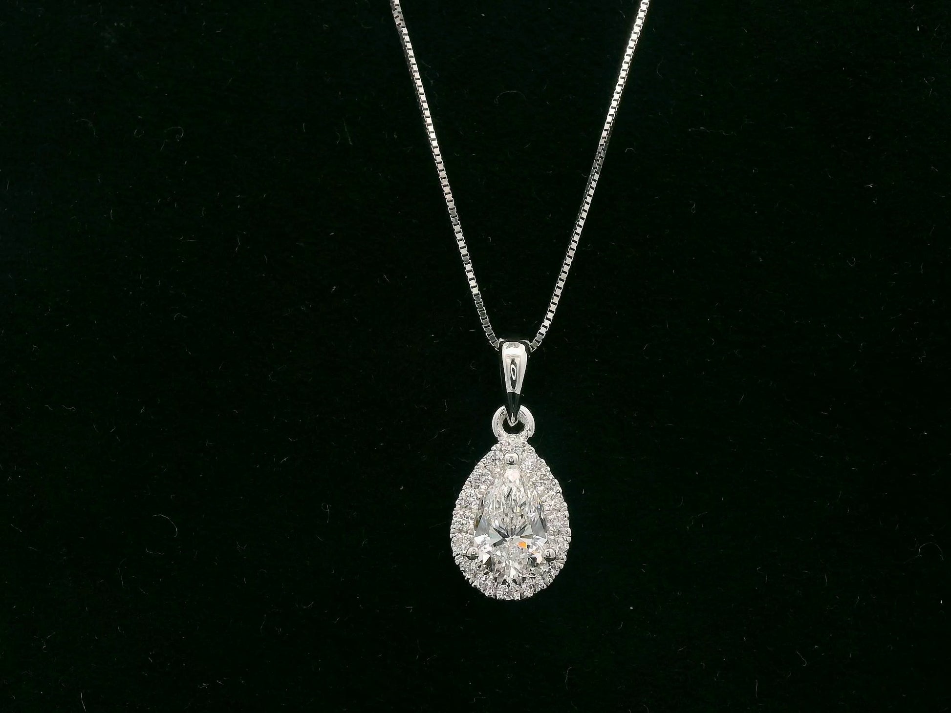 18K white gold pear diamond pendant with 0.51ct D SI1 GIA diamond and 0.14ct halo – Emirates Diamonds