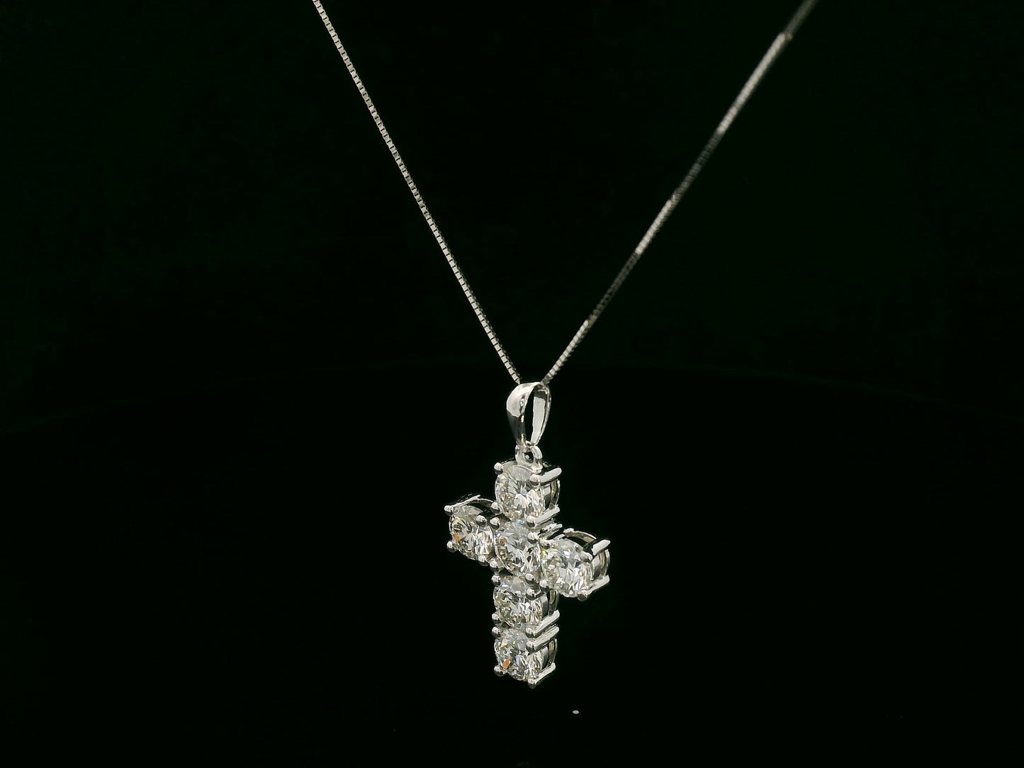 18K white gold diamond cross pendant featuring round-cut natural diamonds totaling 2.20 carats by Emirates Diamonds