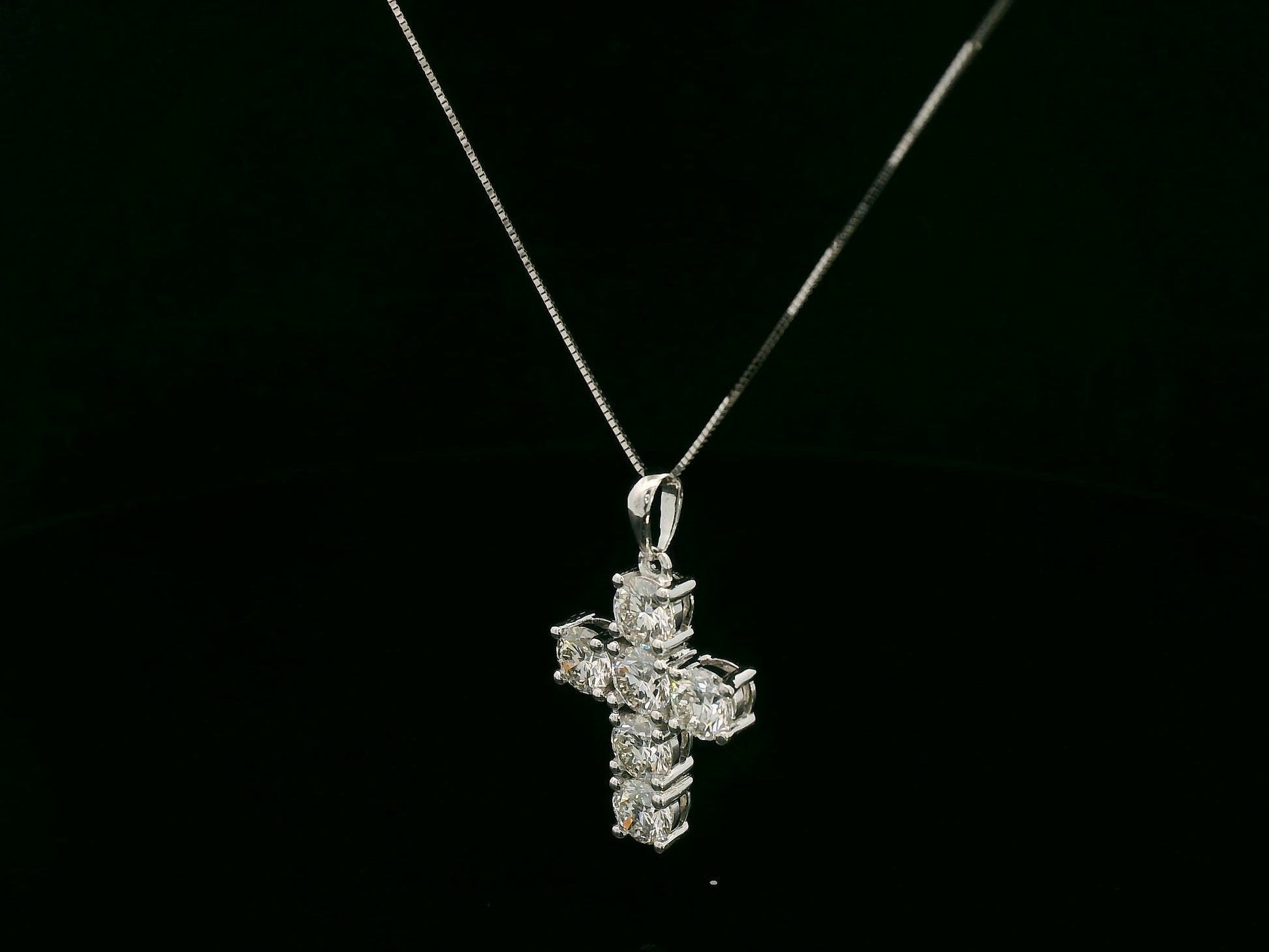 18K white gold diamond cross pendant featuring round-cut natural diamonds totaling 2.20 carats by Emirates Diamonds