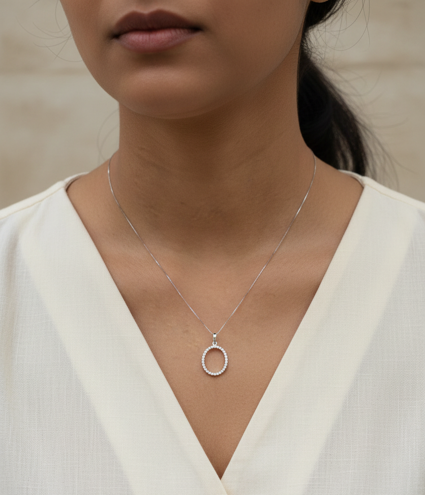 18K white gold oval diamond halo pendant with pavé-set diamonds, 0.25 carat total diamond weight, fine jewelry by Emirates Diamonds
