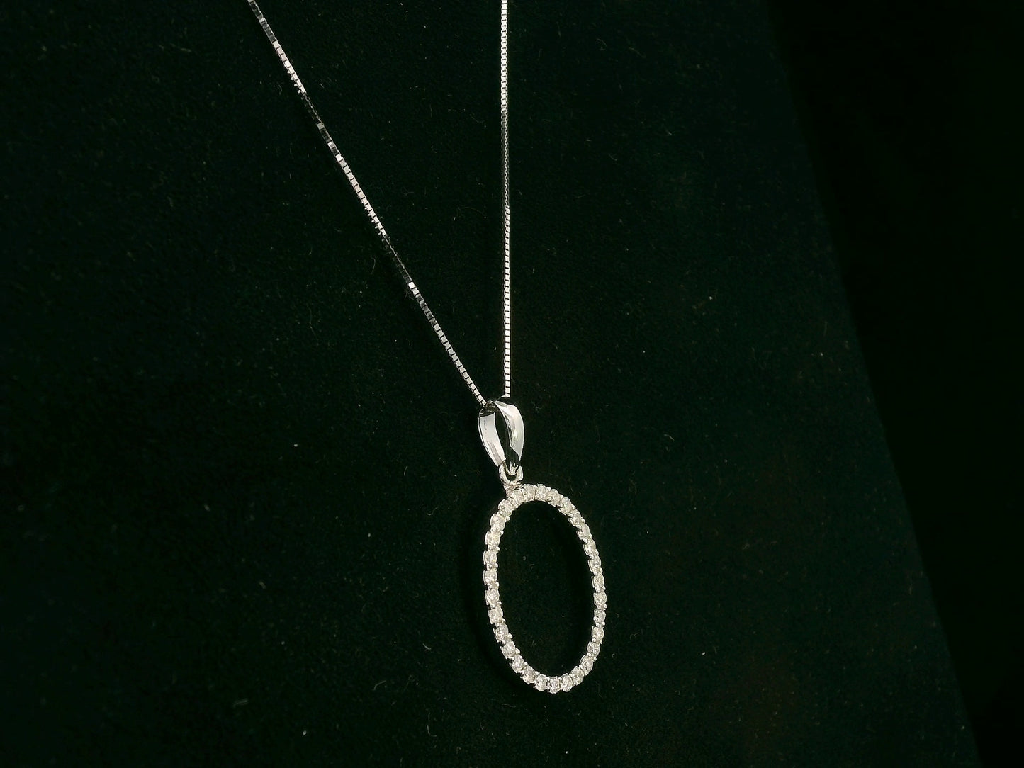 18K white gold oval diamond halo pendant with pavé-set diamonds, 0.25 carat total diamond weight, fine jewelry by Emirates Diamonds
