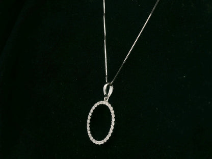 18K white gold oval diamond halo pendant with pavé-set diamonds, 0.25 carat total diamond weight, fine jewelry by Emirates Diamonds