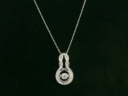 18K white gold diamond drop pendant with swirling design by Emirates Diamonds