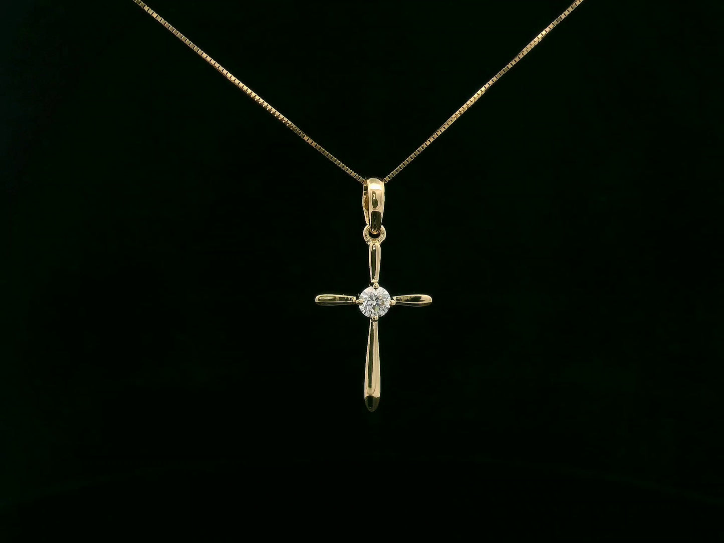 18K yellow gold diamond cross pendant necklace with minimalist design by Emirates Diamonds