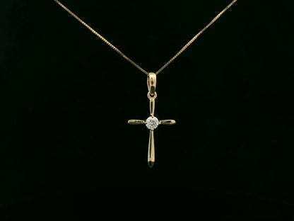 18K yellow gold diamond cross pendant necklace with minimalist design by Emirates Diamonds