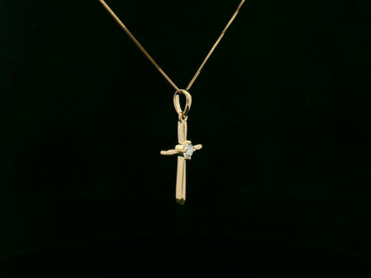 18K yellow gold diamond cross pendant necklace with minimalist design by Emirates Diamonds