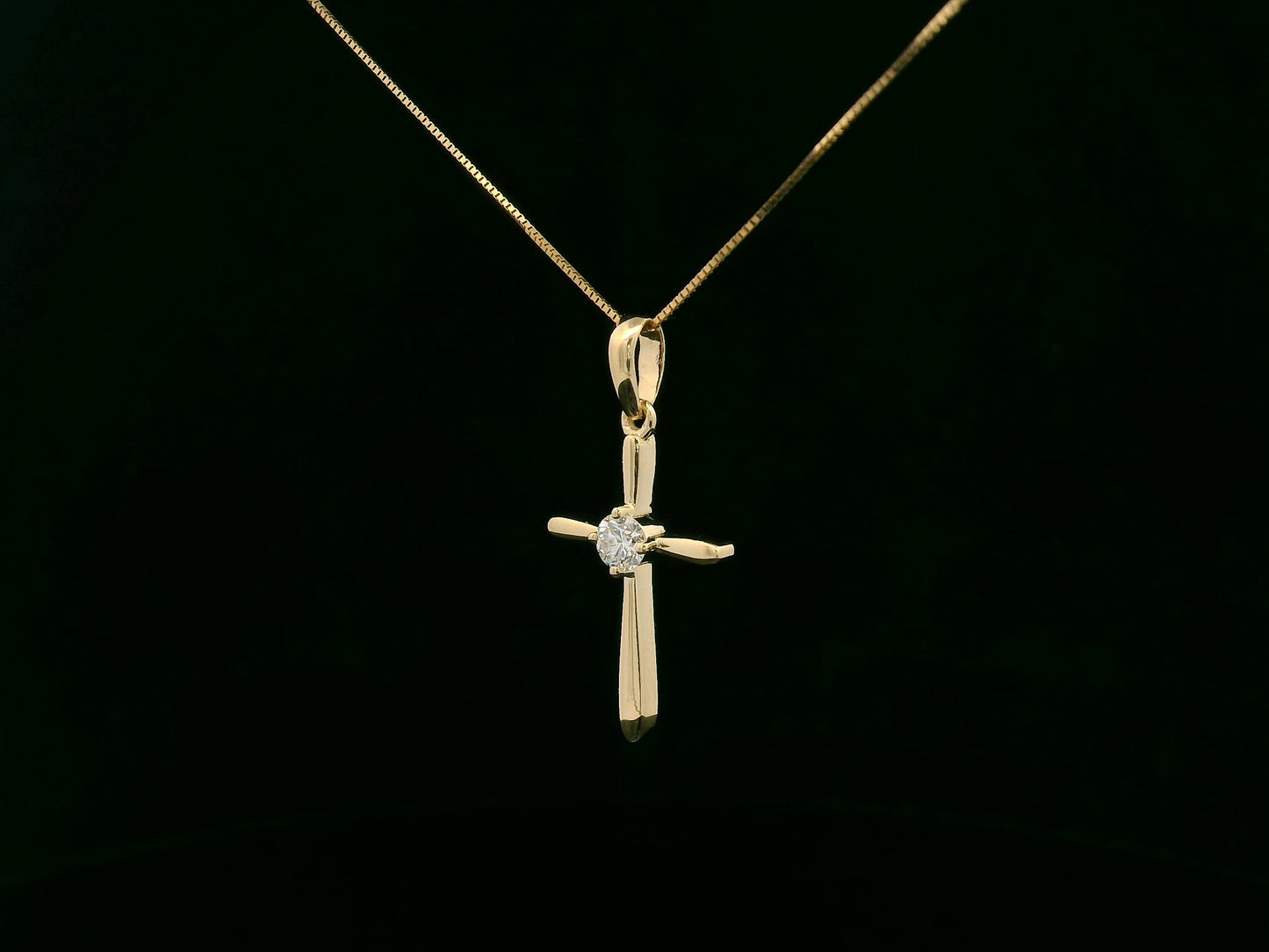 18K yellow gold diamond cross pendant necklace with minimalist design by Emirates Diamonds