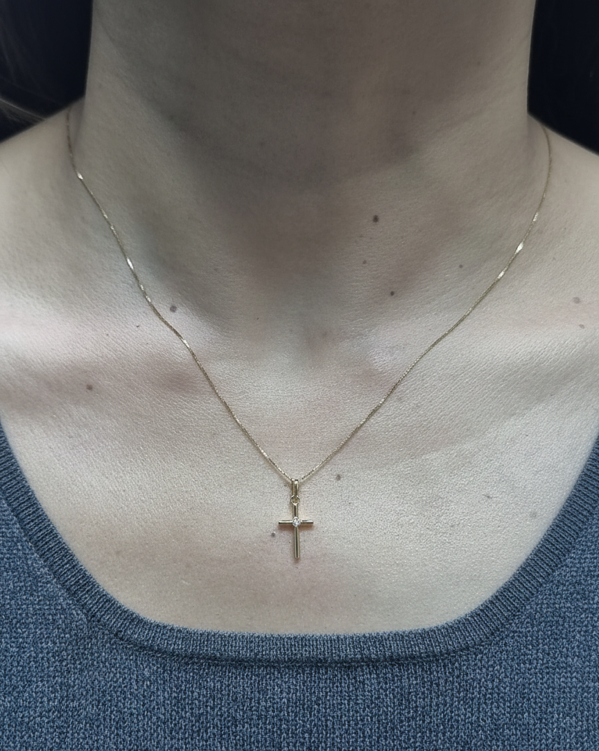 0.02 carat diamond cross pendant in 18K yellow gold minimalist necklace by Emirates Diamonds